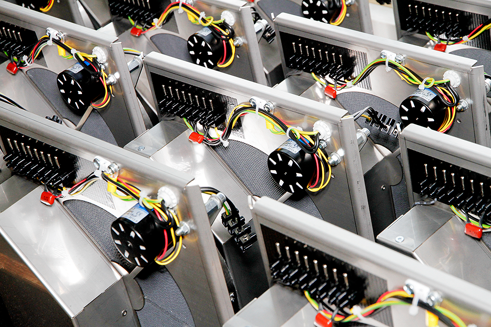 Intermediate result in the production process: One batch of silica gel sorption rotors. Here the control electronics have already been installed.